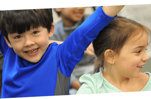 Kids smiling in classroom