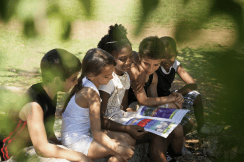 Kids reading outside